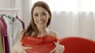 People And Fashion, Happy Woman Trying Out Red Dress In Clothes Shop Stock Footage