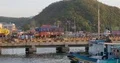 People and heavy loaded trucks leaving ferry in domestic indonesian harbor 4k or 4k+ Resolution