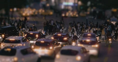 People and holiday shoppers cross a busy street Stock Footage