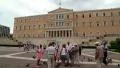People and pigeons near Parliament in Athens, Greece HD Footage