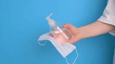 People and protective mask, using alcohol antiseptic gel, Stock Footage 126952011