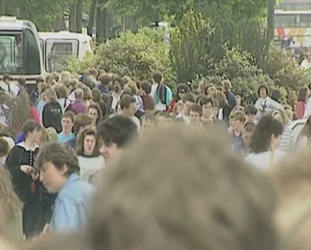 People and queue at base of Eiffel Tower Stock Footage 8918158