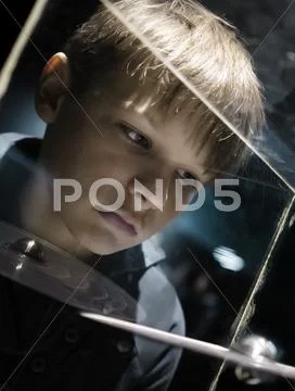People and space. future technologies. boy looking at planetary model in a Stock Photos
