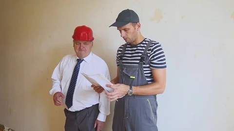 People and teamwork, team of two men at work in construction site. Senior Видео 95324446