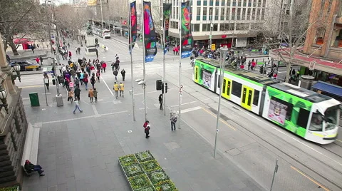 People and traffic in a busy intersection Stock Footage 54305955