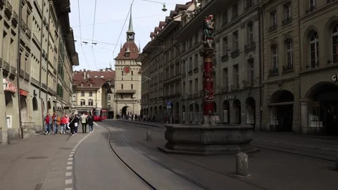 People and trams in Bern old town, establishing shot Stock Footage 270576382