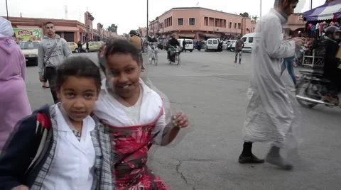 People and vehicles in an intersection in Marrakech Stock Footage 49593922