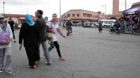 People and vehicles in an intersection in Marrakech Stock Footage 49594527