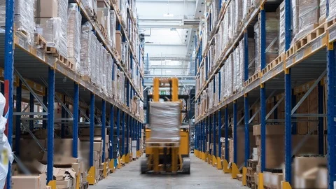 People and vehicles working in warehouse, 4K time-lapse Stock Footage
