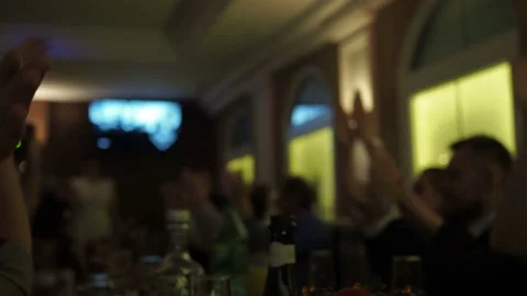 People applaud at the table in the cafe. faces out of focus. thunderous applause Stock Footage 158105846