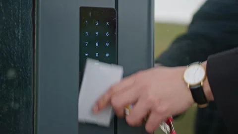People applying a white plastic key card to an electronic Lock. Electronic door Stock Footage 240328510