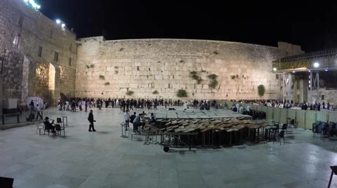 People approaching and praying at the front of the Western Wall; timelapse Video stock 62883874