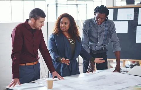 People, architect and talking with document in office for project, review d.. Stock Photos