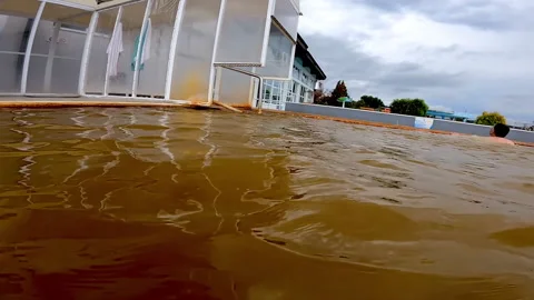 People are bathing at external pool with thermal water in Ozren Thermal Baths. Видео 219653347