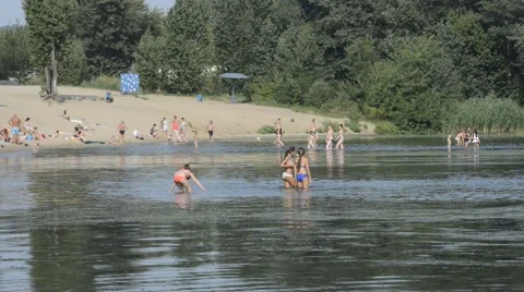 People are bathing in the river shallow. Stock Footage 65427541
