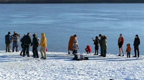 People are  bathing in winter river at  Epiphany. Stock Footage 60798998