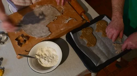 People Are Cutting The Pastry by Angel Shaped Mold Carefully Putting Them to a Stock Footage 59129402
