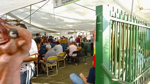 People Are Eating And Queue Up At The Food Stand - Forwards Stock Footage 118636603