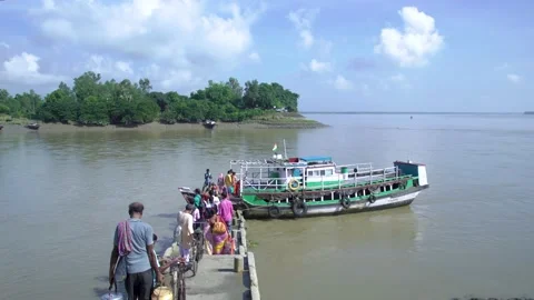 People are getting on the launch, ferry or boat to cross the river Stock Footage 162871019
