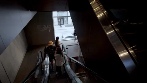 People are going down on the escalator at modern interior building, Chicago Il Stock Footage 306345777
