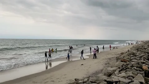 People are having fun and runs at sunset beach ,Beach holidays travel concept Stock Footage 164876857