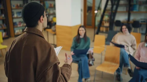 People are learning in a library during a group session with a speaker standing  Stock Footage 337106538