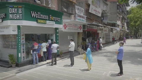 People are lining outside pharmacy during lockdown amid COVID 19 Stock Footage 132610832