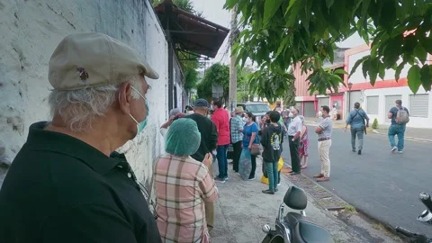 People are lining to vote El Salvador Legislative Elections: February 28, 2021 Stock Footage 149857461