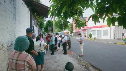 People are lining to vote El Salvador Legislative Elections: February 28, 2021 Stock Footage 149857641