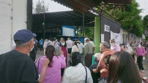 People are lining to vote El Salvador Legislative Elections: February 28, 2021 Stock Footage 149857726