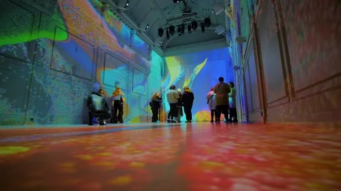 People are looking around the immersive exhibition - video mapping show Stock Footage 339776935