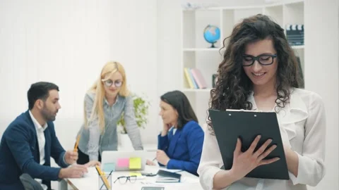 People are looking at documents and discussing their ideas in 4k slowmotion Video stock 137810959