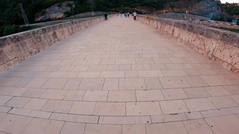 People are passing over Old Bridge in Visegrad. Stock Footage 166244928