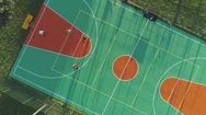 People Are Playing Basketball On Court. Aerial Vertical Top View. Stock Footage