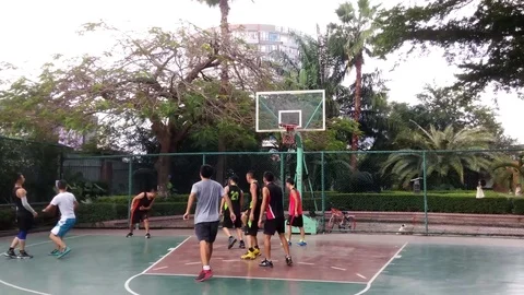 People are playing basketball during the National Day holiday Stock Footage