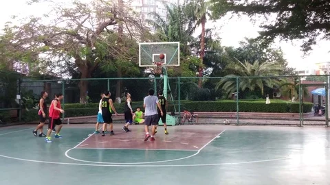 People are playing basketball during the National Day holiday Stock Footage