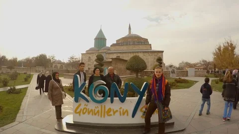 People are posing for large letters of KONYA on the square in front of Selimiye Stock Footage 82276901