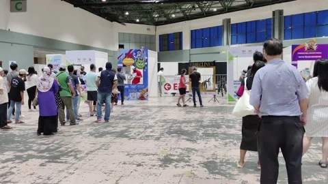 People are queuing and taking photo with the Covid-19 vaccination placard 動画素材 157012245