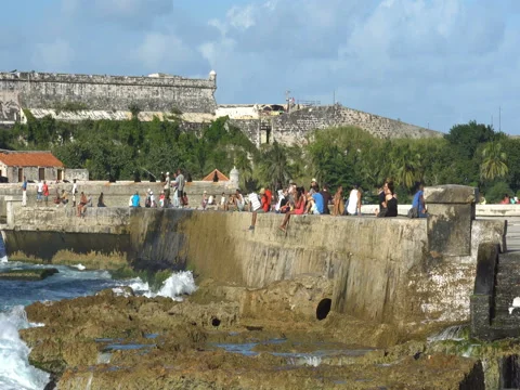 People are sitting on the seafront Video stock 70990856
