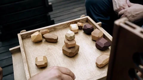 People are sitting at a table and playing an active board game Stock Footage 342030861