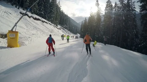 People are skiing in the mountains ski resort slopes in Bansko Stock Footage