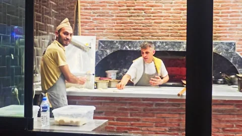 People are standing in a kitchen preparing. Stock Footage 283000210