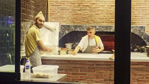 People are standing in a kitchen preparing. Stock Footage 284674207