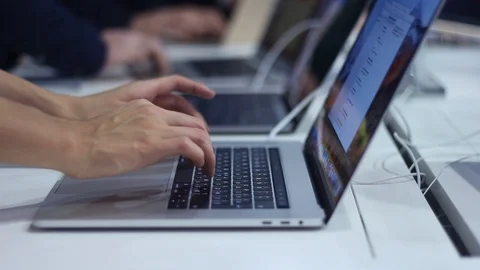 People are testing new laptops in the office Stock Footage 87135739