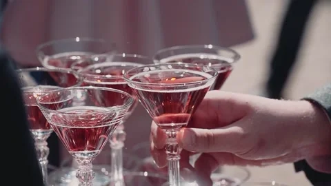 People are treated to champagne while dismantling glasses from the pyramid Stock Footage 137558901