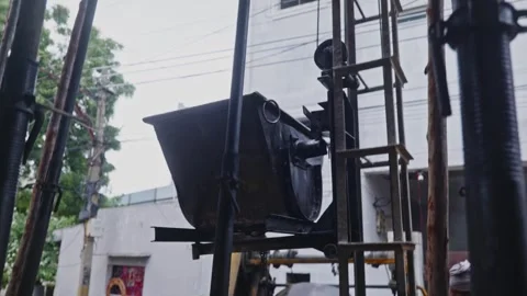 People are using Tower Hoist concrete Lift with centering jack pipes and plates Stock Footage 318000210