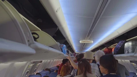  People are waiting to get off the plane. Stock Footage 123747499