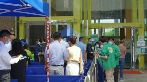 People are waiting in queue for Covid-19 vaccination in Sun Yat Sen Stock Footage 157545773