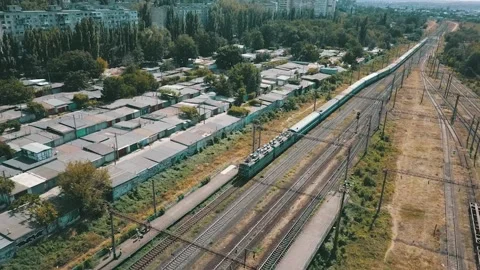 People are waiting for a train that pulls up to them on the platform. They are w Stock Footage 173800421
