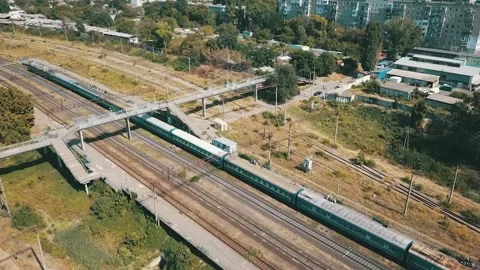 People are waiting for a train that pulls up to them on the platform. They are w Stock Footage 173800893